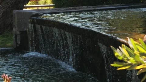Overflow of water from a dam Stock Footage 295379260