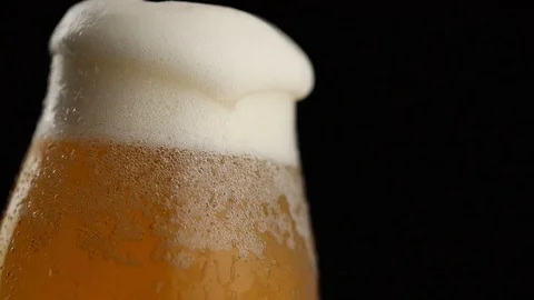 Overflowing beer glass Stock Footage 125102671