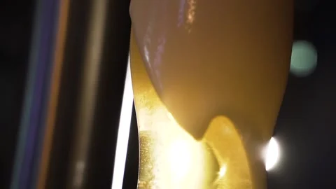 Overflowing beer glass Stock Footage 153974261