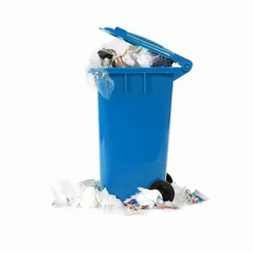 Overflowing blue garbage bin Stock Photos