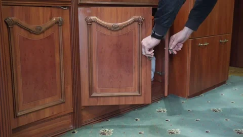 Overflowing closet with clothes that fall out when doors are opened. Stock Footage 273293871