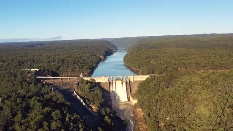 Overflowing dam on Warragamba river in Blue mountains – aerial fly 4k. Stock Footage 174948799