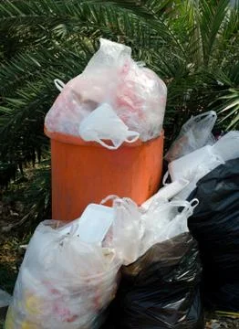 Overflowing garbage bin Stock Photos