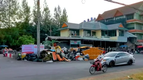 Overflowing garbage bins on dirty tropical street environmental pollution c.. Stock Footage 337018853