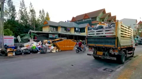 Overflowing garbage bins on dirty tropical street environmental pollution c.. Stock Footage 337018863
