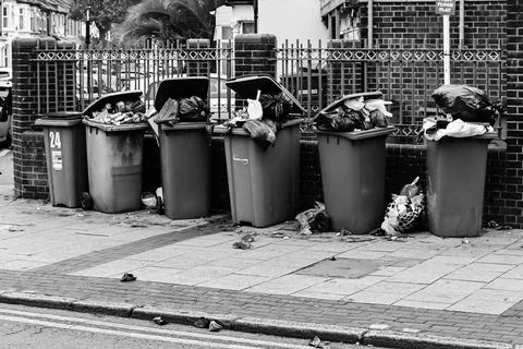 Overflowing garbage container in London Stock Photos