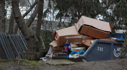Overflowing garbage dumpster with boxes, Frankfurt, Germany Stock Footage 61320866