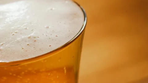 Overflowing glass of beer Stock Footage 12686993
