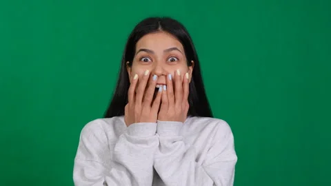 Overflowing joy, in a studio portrait, a young woman exudes happiness, triumph Stock Footage 265209230