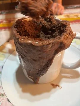 Overflowing mug cake Stock Photos