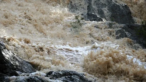 Overflowing river wild waters in slow motion Stock Footage 91836942