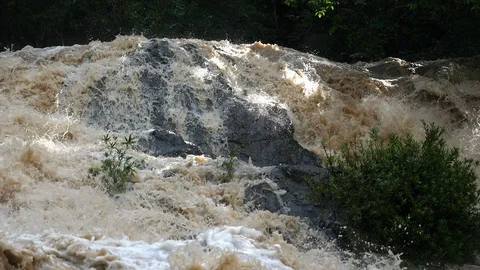 Overflowing river wild waters in slow motion Stock Footage 91837115