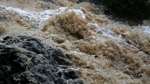 Overflowing river wild waters in slow motion Stock Footage 91837128