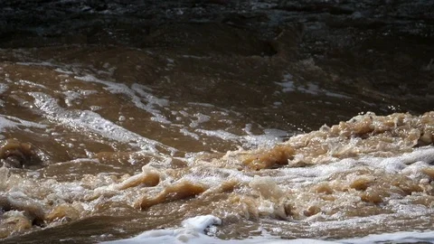 Overflowing river wild waters in slow motion Stock Footage 91837836