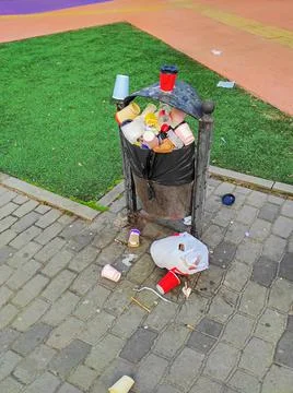 Overflowing trash bin Stock Photos