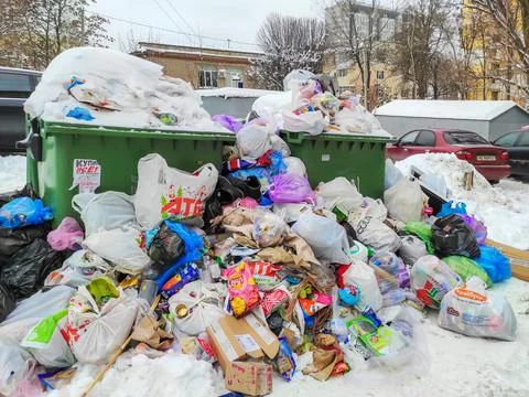 Overflowing trash cans in wintertime Stock Photos