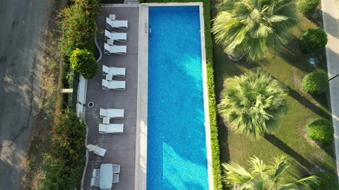 Overflying View Of A Luxury Swimming Pool Stock Footage 250399672