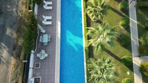 Overflying View Of A Luxury Swimming Pool Stock Footage 250680962