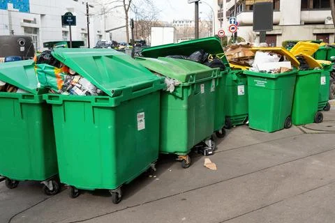 Overfull garbage bins in Paris during March 2023 binmen strike Stock Photos