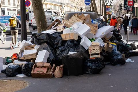 Overfull garbage bins in Paris during March 2023 binmen strike Stock Photos