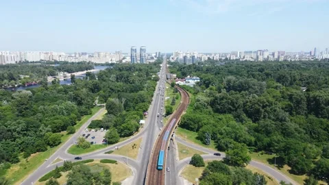 Overground metro, passing over the bridge, entrance to the city from the station Stock Footage 156957363