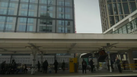 Overground Train leaving Platform with People in Croydon Stock Footage 217652147