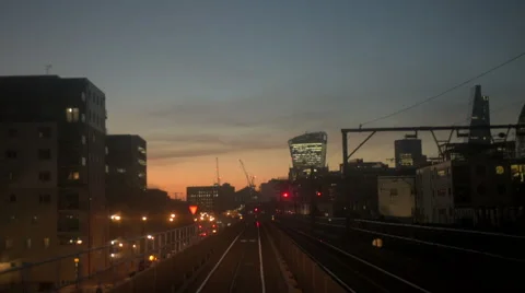 An overground train travels through central London, UK at night Video stock 45513404