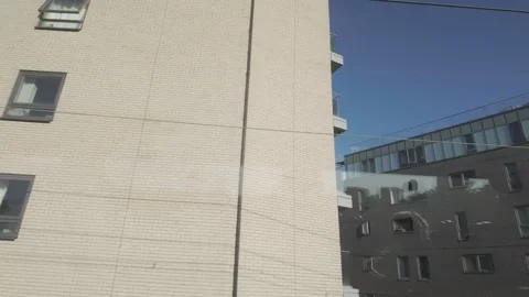 Overground train, view from window. High rise Flats. London.UK 5.5.2026 Stock Footage 337429677