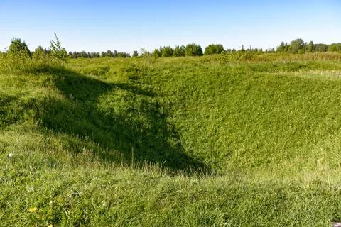 Overgrown with grass craters from shells and bombs on the "Nevsky Pyatachka", Stock Photos