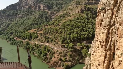 Overhang pathway to the river &amp; valley after bridge Caminito del Rey Video stock 220741495