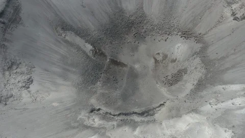 Overhead aerial ascends over Purace volcano crater as clouds roll past Stock-Footage 105292053