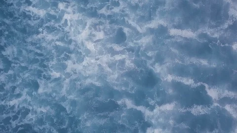 Overhead aerial camera captures the calm waves of the blue ocean Ariya's Beach Stock Footage 123392510