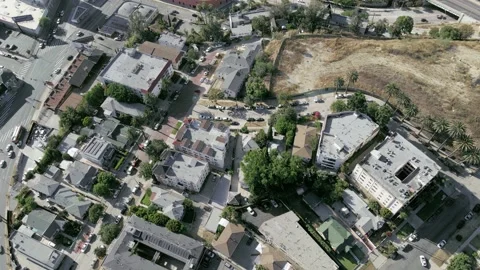 Overhead aerial camera rises above roofs of downtown Los Angeles, California Stock-Footage 158386814