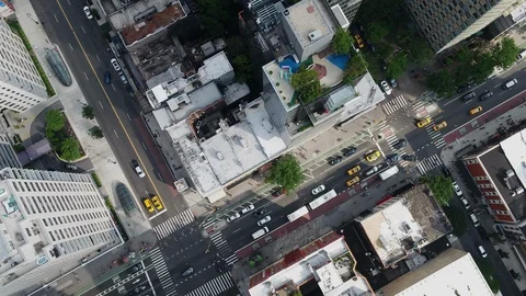 Overhead aerial diagonal cars driving Manhattan traffic NYC New York City Stock Footage