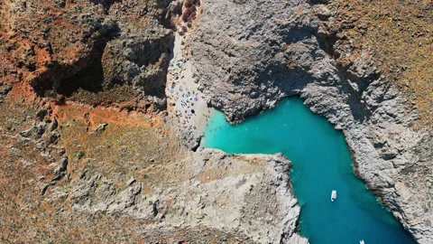 Overhead aerial drone view of the small sandy beach and turquoise cove with Stockbeeldmateriaal 339294495