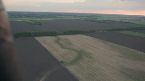 Overhead aerial farmland patchwork view from hot air balloon at sunset Stock Footage 317194839