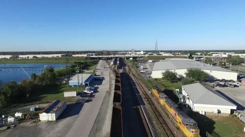 Overhead aerial of a freight train in a staging yard in Orlando, Florida. Video stock 62470496
