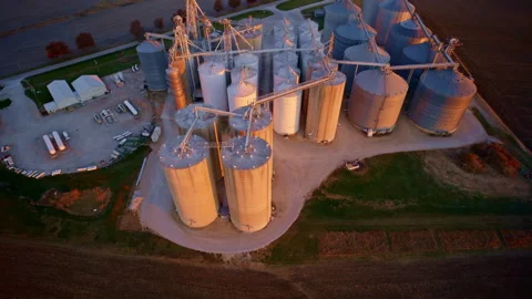 Overhead aerial of numerous grain silos clustered at a grain elevator Stock Footage 328720293