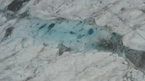 Overhead aerial sails over a bright blue lake on the Knik Glacier in Alaska Vídeos de archivo 159255485
