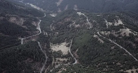 Overhead aerial top view over car travelling on road in countryside autumn Video stock 128916265