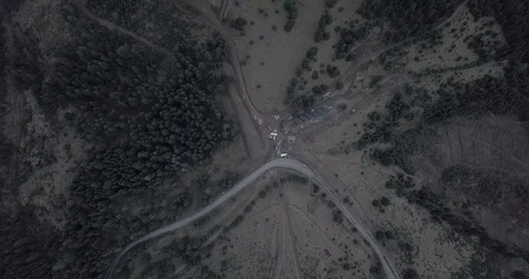 Overhead aerial top view over car travelling on road in countryside autumn Stock Footage 128917401