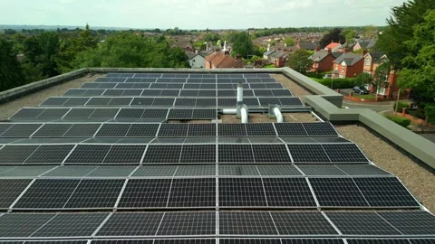 Overhead aerial video of a solar panel array filmed on a bright and sunny day Stock Footage 314783554