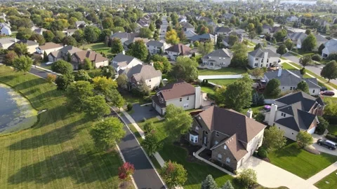 Overhead aerial view of colorful trees, residential houses. Suburb Stock Footage 141023085