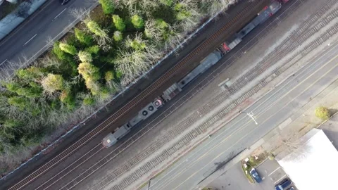 Overhead Aerial View of Freight Train Moving Along Tracks Video stock 147108205