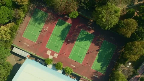 Overhead aerial view of multiple green and red tennis courts Stock-Footage 342588286