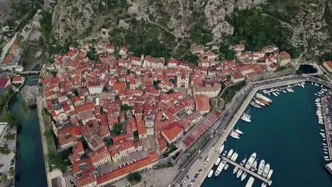 Overhead aerial view of rooftops and streets in historic old town of Kotor and Stock Footage 114314828