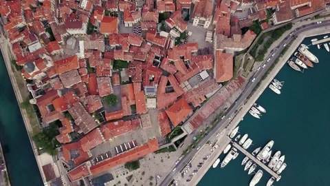 Overhead aerial view of rooftops and streets in historic old town of Kotor and Stock Footage 114315286