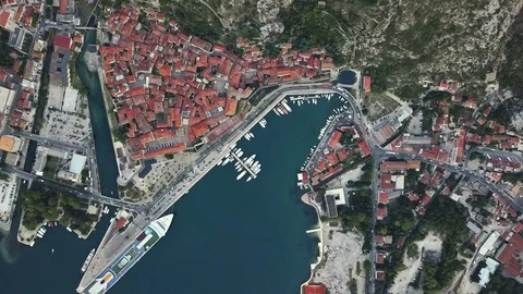 Overhead aerial view of rooftops and streets in historic old town of Kotor and Stock Footage 114315754