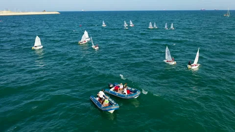 Overhead aerial view of training with optimist near the Marina Valencia, Spain. Stock Footage 144542110