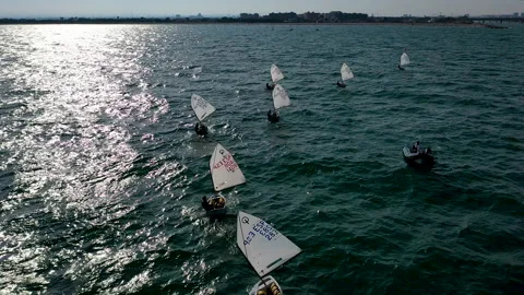 Overhead aerial view of training with optimist near the Marina Valencia, Spain. Stock Footage 144542802